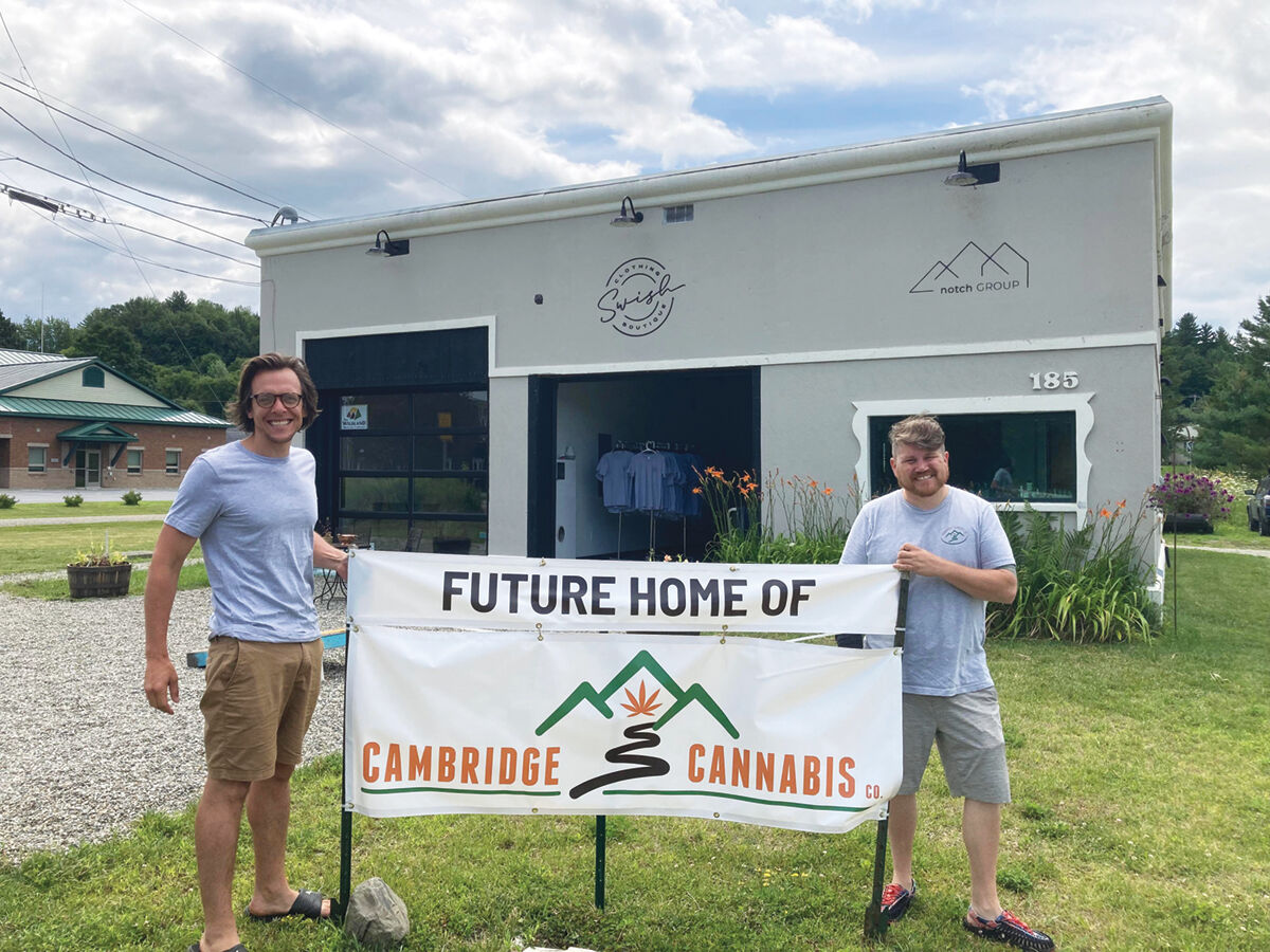 Christopher Preston and Rusty Kenney in front of their new business, Cambridge Cannabis
